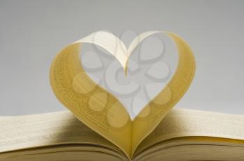 Pages of a book making a heart shape