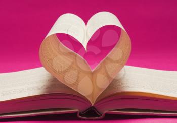 Pages of a book making a heart shape