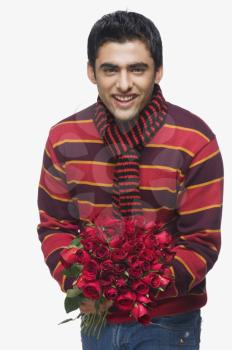 Man holding a bouquet of flowers