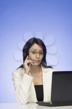 Portrait of a businesswoman working on a laptop