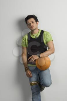 Portrait of a man holding a basketball