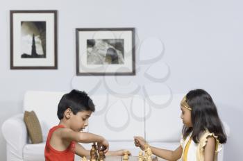 Boy and a girl playing chess