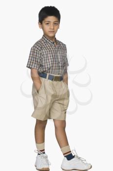 Portrait of a boy standing with his hands in pockets