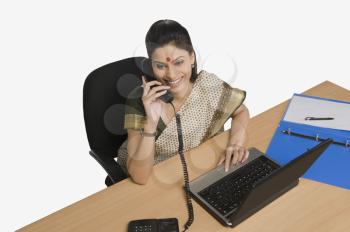 Businesswoman talking on the telephone in an office