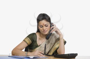 Businesswoman talking on the telephone in an office