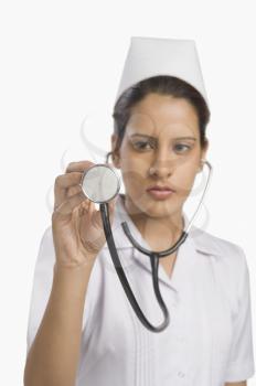 Female nurse holding a stethoscope