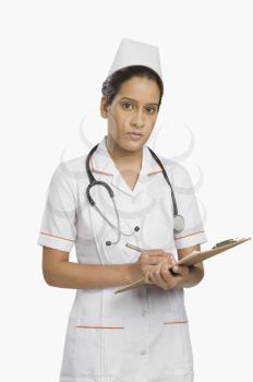 Portrait of a female nurse holding a clipboard