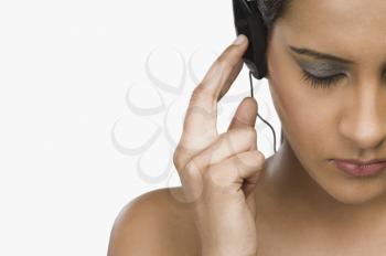 Woman listening to headphones