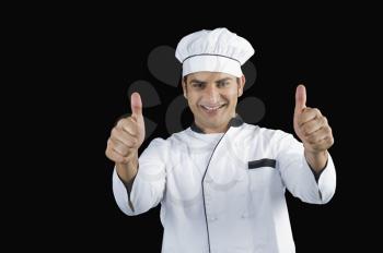 Portrait of a chef gesturing thumbs up sign
