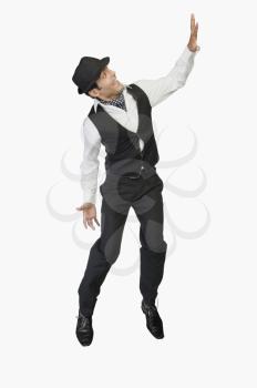 Businessman showing stop gesture and smiling