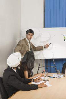 Businessman giving presentation in a conference room