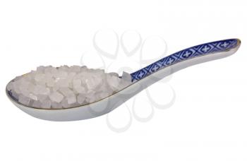Close-up of a spoon full of crystal sugar