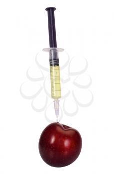 Syringe being injected into a plum