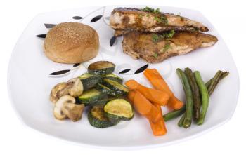 Chicken breast with bread and vegetables on a plate