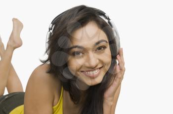 Portrait of a woman listening to headphones