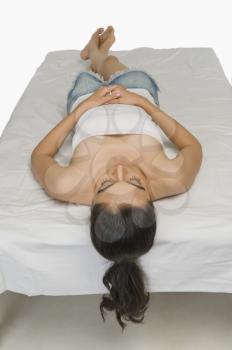 High angle view of a woman sleeping in the bed