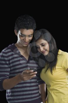 Couple looking at a mobile phone