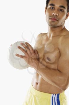 Portrait of a man holding a soccer ball