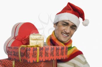 Portrait of a man holding Christmas presents