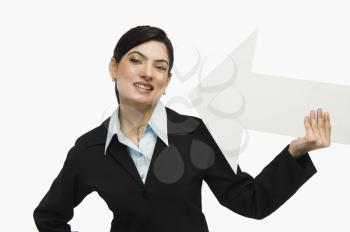Businesswoman holding an arrow sign