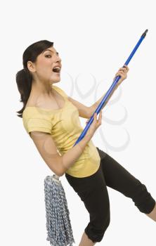 Woman dancing with a mop