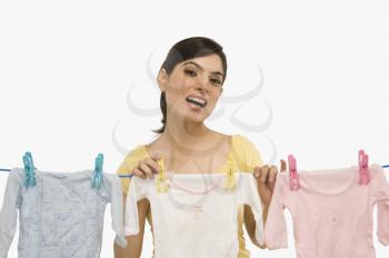 Woman hanging clothes on a clothesline