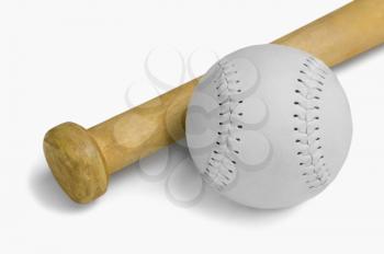 Close-up of a baseball bat with a baseball