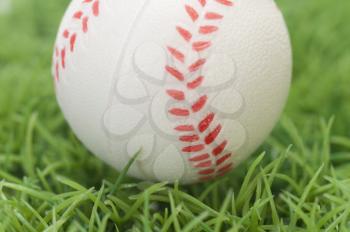 Close-up of a baseball on grass