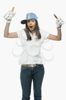 Portrait of a female cricket fan cheering