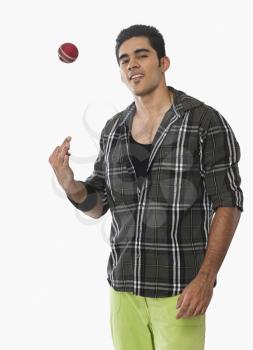 Portrait of a cricket player catching a ball