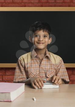 Boy imitating a teacher in a classroom