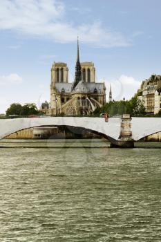 Bridge with a cathedral in the background, Notre Dame de Paris, Seine River, Paris, France