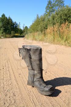old boot on road