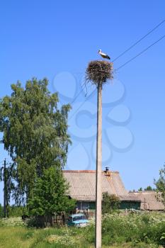 crane on pole amongst villages