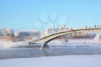 narrow bridge through ice river