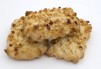 tasty cookies with nutlets on a white background