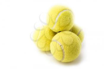 Four tennis balls isolated on white background