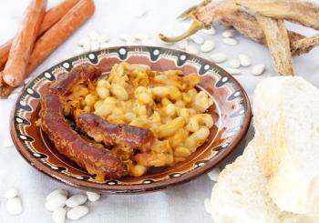Traditional Macedonian food Tavce Gravce on clay plate