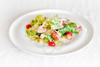 summer salad with shrimps on a white plate