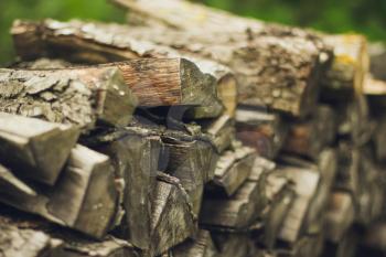 A stack of firewood close up with a large depth of field