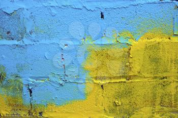 Blue-yellow paint on a wall