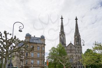 Beautiful and tall towers on evangelical church in Europe against the sky