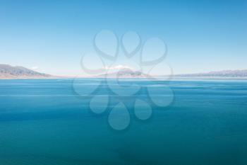 Calm surface of the lake with a sunny day. Shot in Sayram Lake, Xinjiang, China.