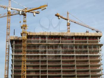 Construction cranes at a building site