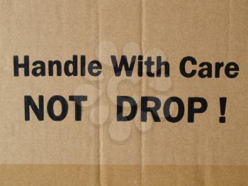 Fragile Handle with Care Do not drop label on a corrugated cardboard box