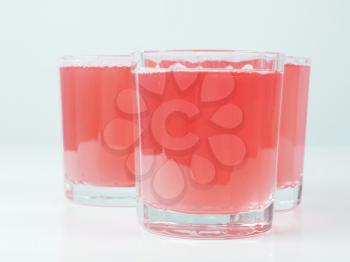Pink grapefruit juice glasses on continental breakfast table