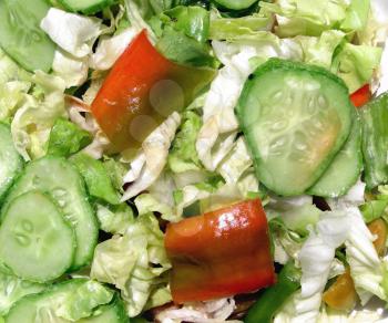 Green salad with lettuce and vegetables, peppers, cucumbers