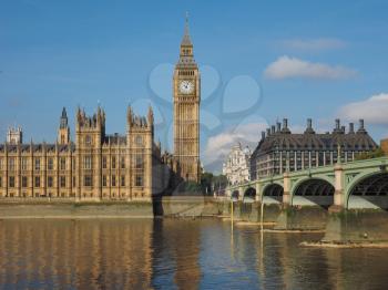 Houses of Parliament aka Westminster Palace and Westminster Bridge over River Thames in London, UK