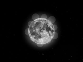 Full moon seen with an astronomical telescope, with starry sky