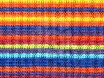 Multicoloured striped fabric texture useful as a background